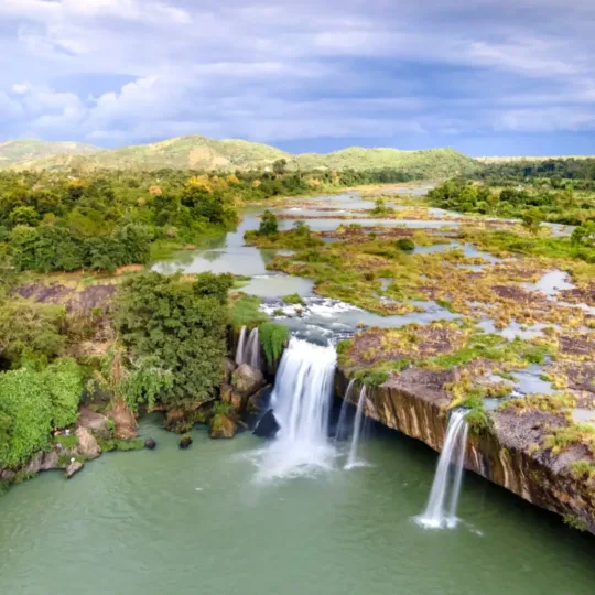 Aerial view of Dray Nur Waterfall surrounded by greenery near Buon Ma Thuot