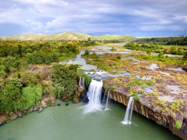 Aerial view of Dray Nur Waterfall surrounded by greenery near Buon Ma Thuot
