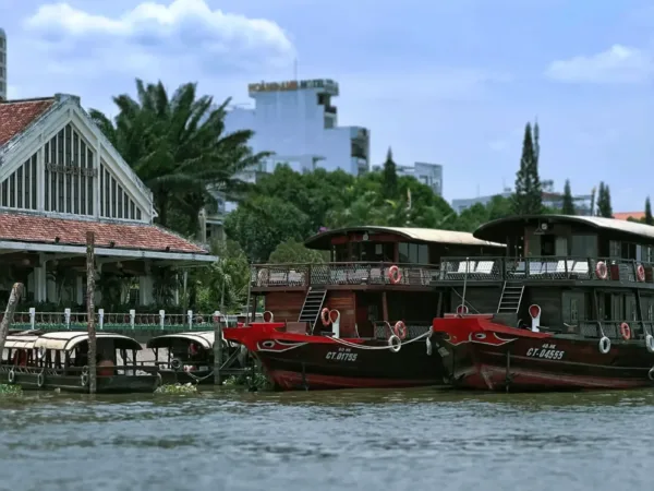 Traditional wooden boats moored along the riverfront near Cai Rang, Can Tho