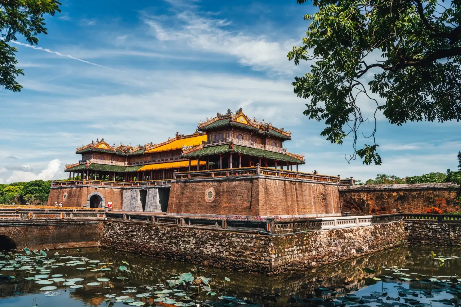 Ngo Mon Gate of the Hue Imperial City reflected in the surrounding moat