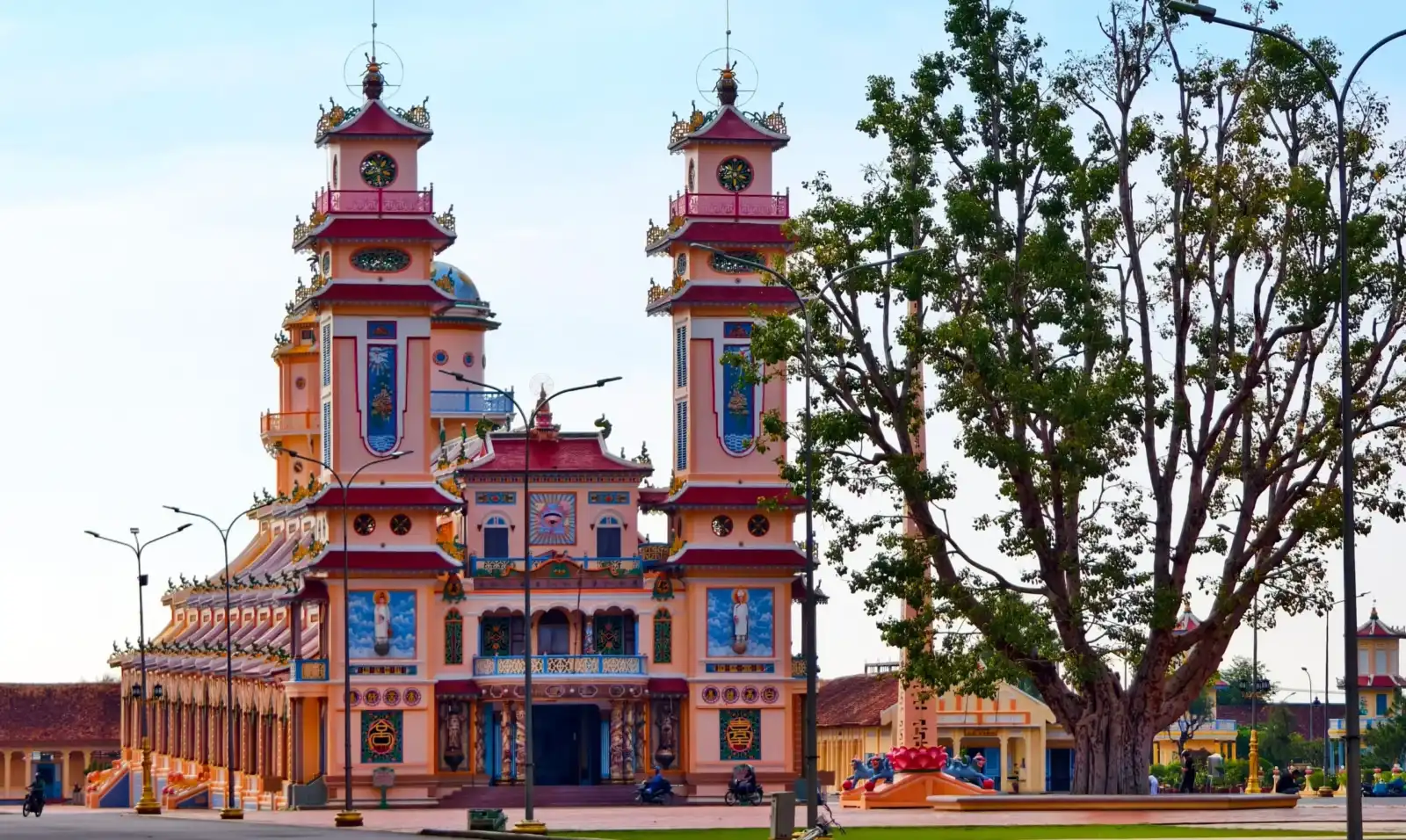 The colorful twin-towered facade of the Cao Dai Holy See temple in Tay Ninh