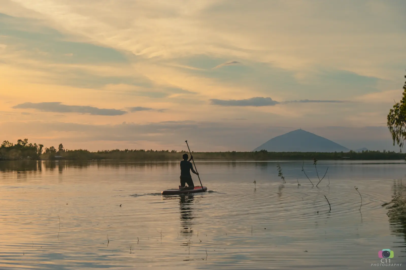 The expansive and calm waters of Dau Tieng Lake, a large reservoir located in the Tay Ninh Province of Vietnam.